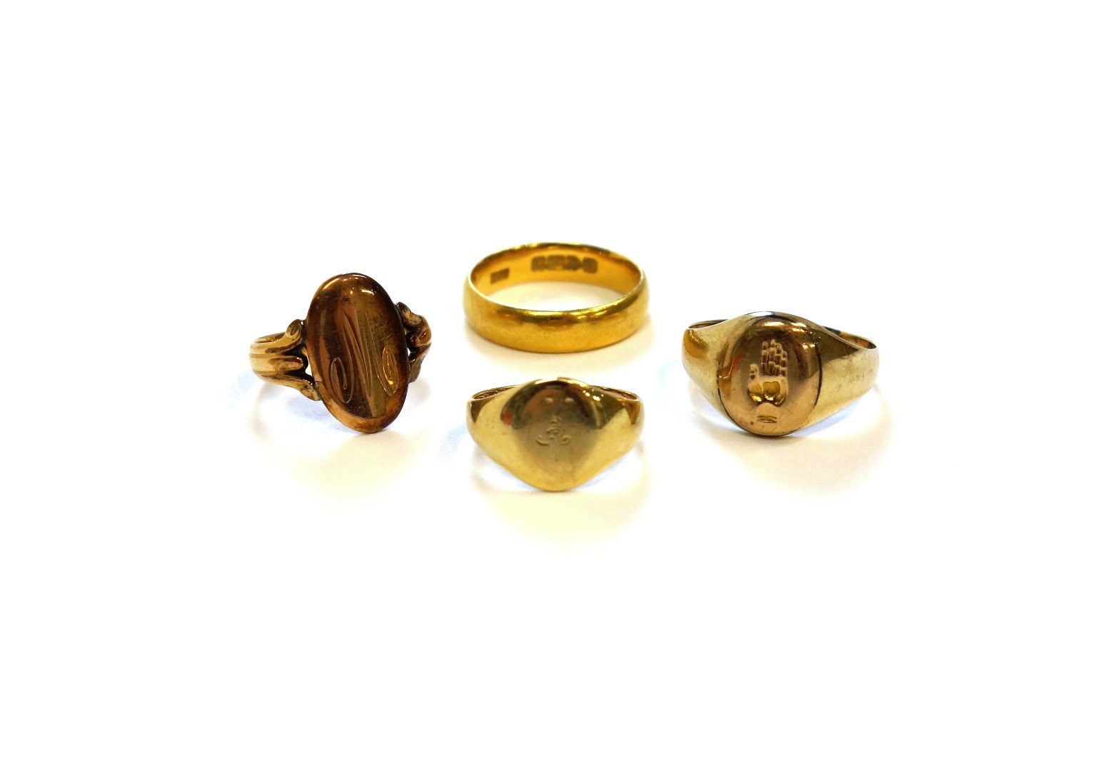 Appraisal: A ct gold oval signet ring two further gold signet