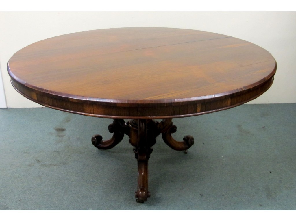 Appraisal: A Victorian rosewood breakfast table the circular top raised over