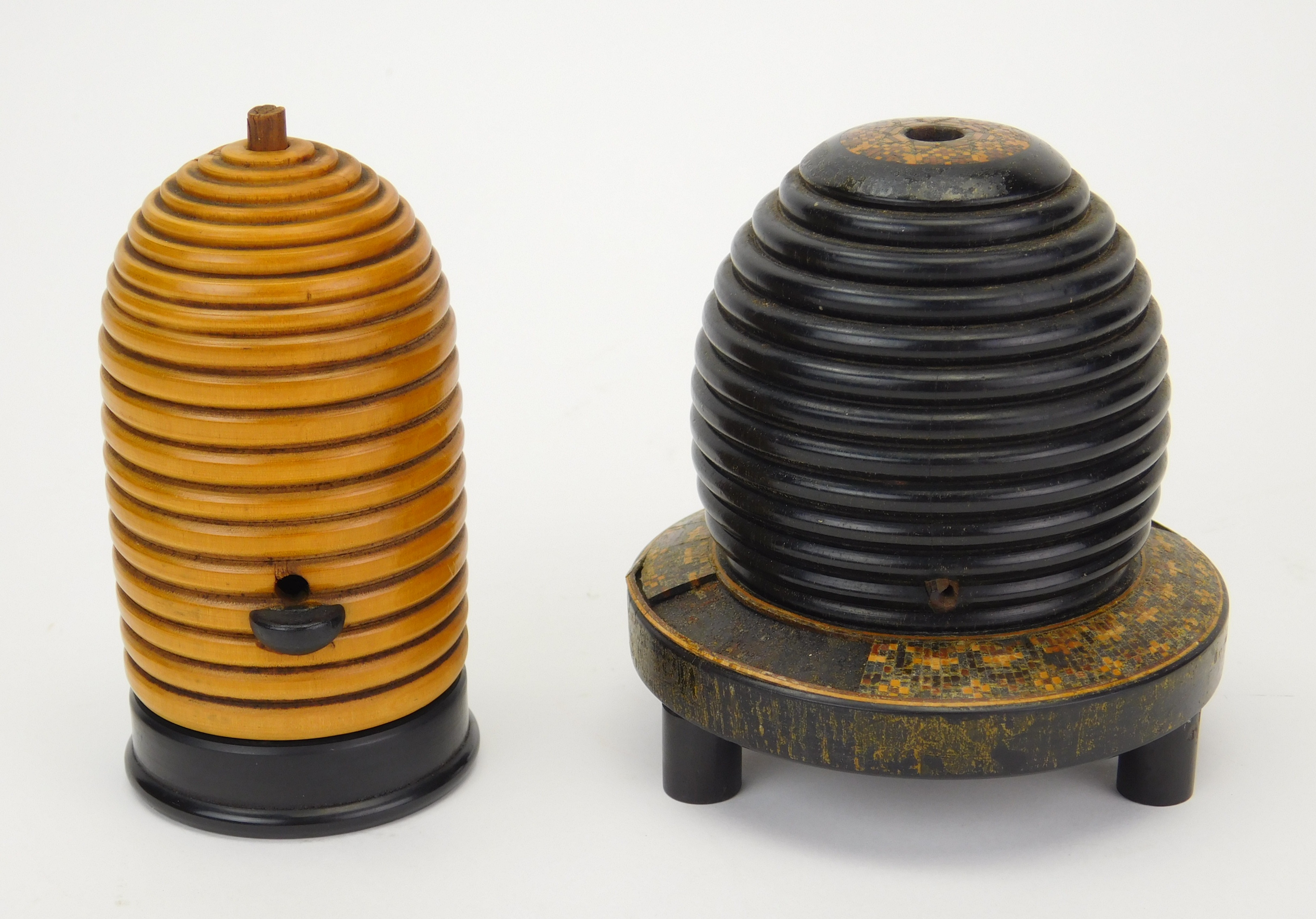 Appraisal: Turned wood spool holders in the form of bee skeps