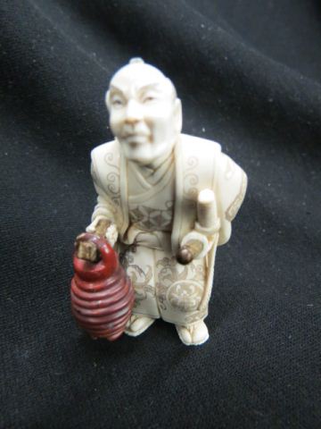 Appraisal: Ivory Figurine of a Samurai Warrior holding a stone hilted