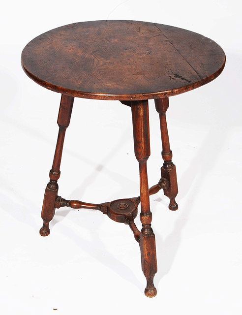 Appraisal: A TH CENTURY ELM CRICKET TABLE on original baluster turned