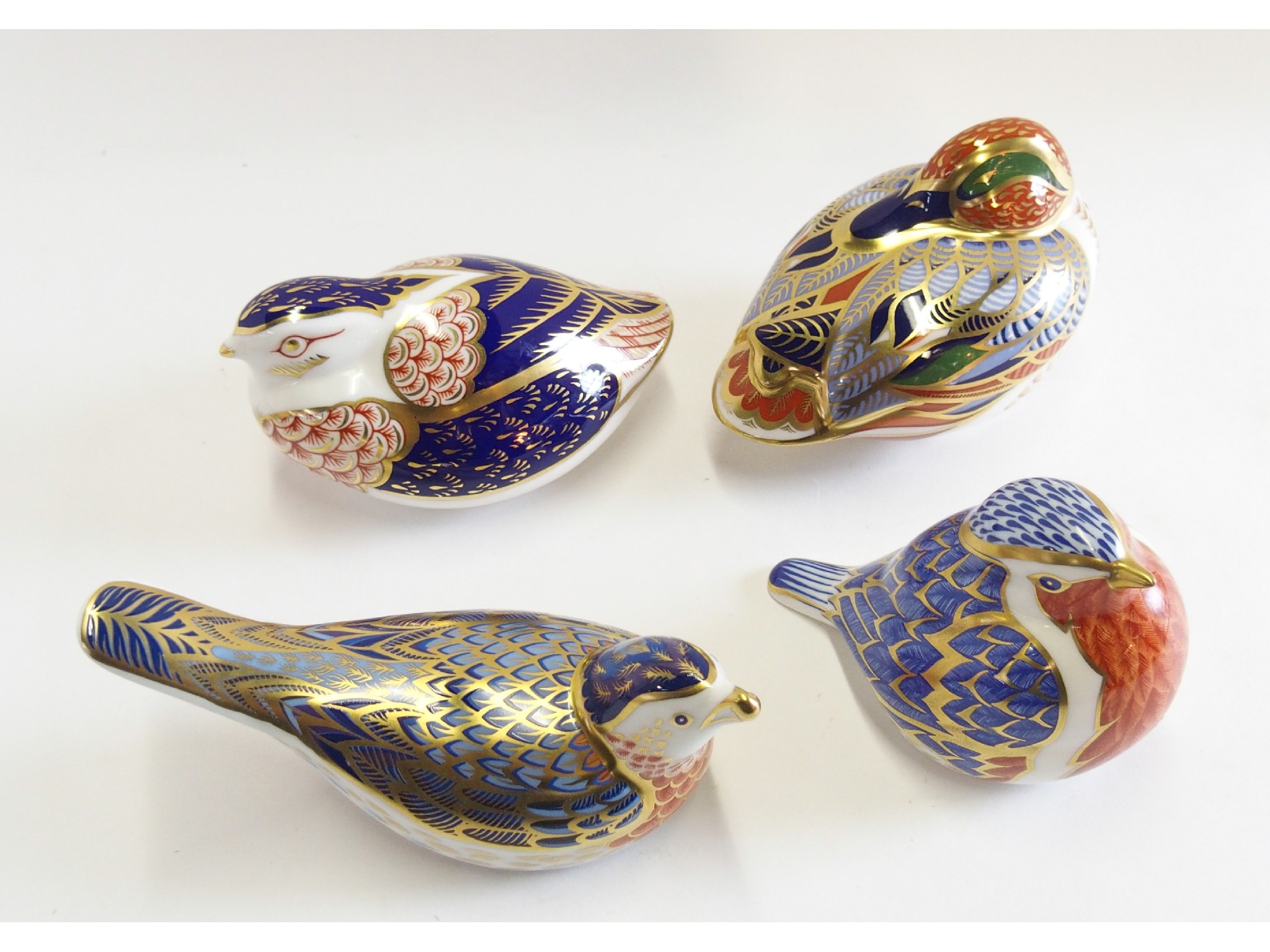 Appraisal: Four Royal Crown Derby porcelain paperweights of birds