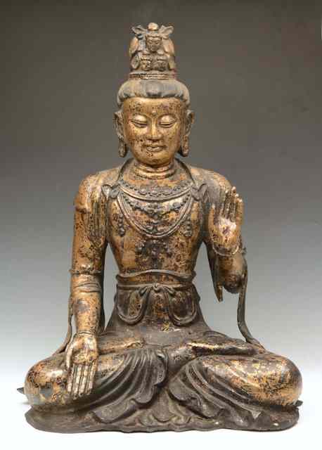 Appraisal: A TIBETAN GILT BRONZE BUDDHA in lotus position with hand