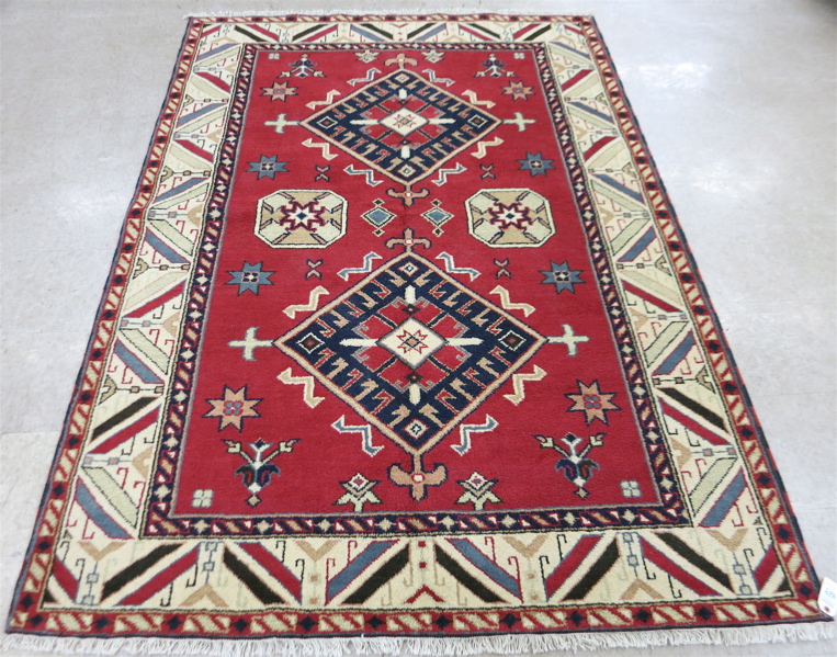 Appraisal: HAND KNOTTED ORIENTAL AREA RUG Indo-Kazak double geometric medallion design