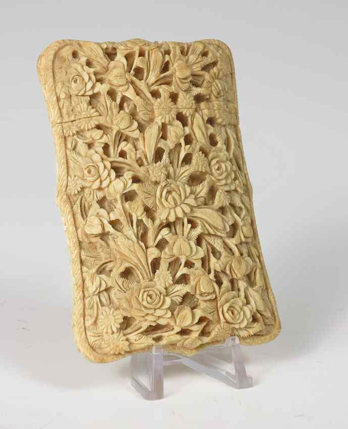 Appraisal: CHINESE CARVED IVORY CARD CASE Detail relief carved floral motif