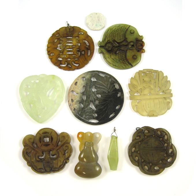 Appraisal: TEN CHINESE CARVED HARDSTONE PENDANTS in various colors and carved