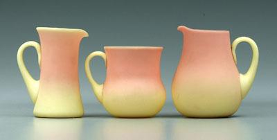 Appraisal: Three small Burmese pitchers all with satin finish one pear