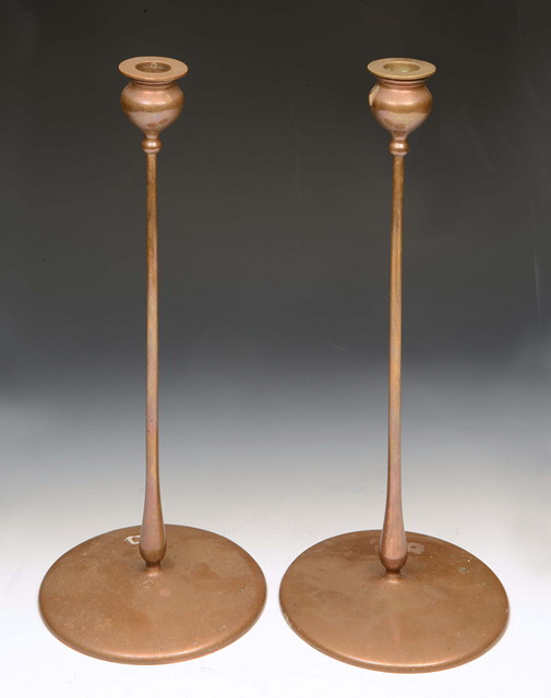 Appraisal: A pair of Jarvie American copper candlesticks of Delta form