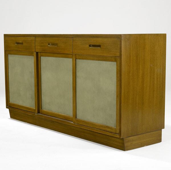 Appraisal: EDWARD WORMLEY DUNBAR Walnut sideboard with three divided drawers and