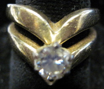 Appraisal: karat yellow gold diamond ring Abstract setting approximately carat round