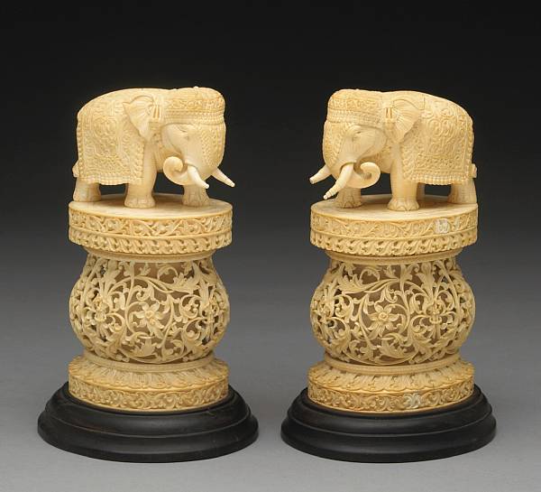 Appraisal: A pair of Indian carved ivory elephants on pedestals Each