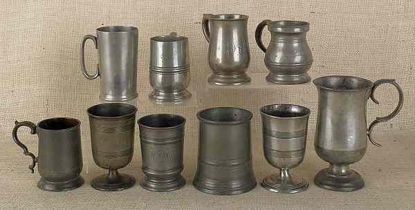 Appraisal: Collection of English pewter measures cups and goblets to include