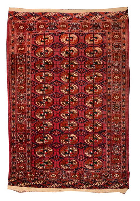 Appraisal: A TEKKE WINE GROUND SMALL RUG with three rows of