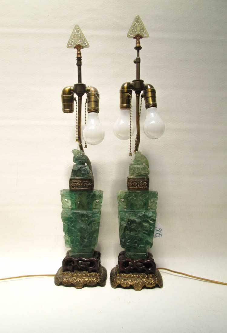 Appraisal: PAIR OF CHINESE CARVED HARDSTONE TABLE LAMPS each of lidded