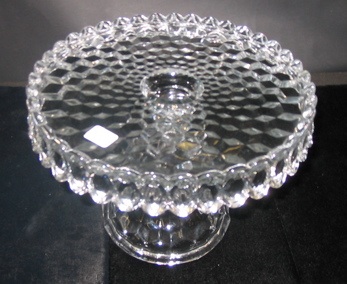 Appraisal: A FOSTORIA GLASS CAKE STAND in the American pattern -