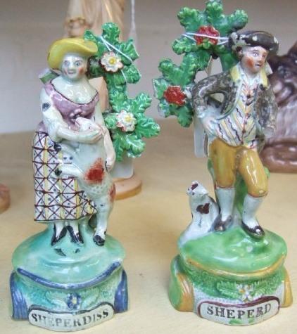 Appraisal: A pair of th century pearlware figures of a shepherd