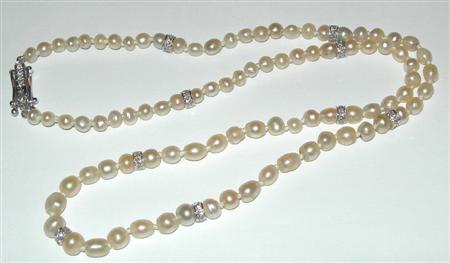 Appraisal: A small pearl and diamond necklace composed of graduated off-round