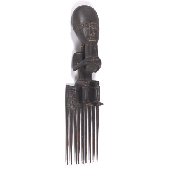 Appraisal: CARVED WOOD AFRICAN COMB x Large carved wood and patinated