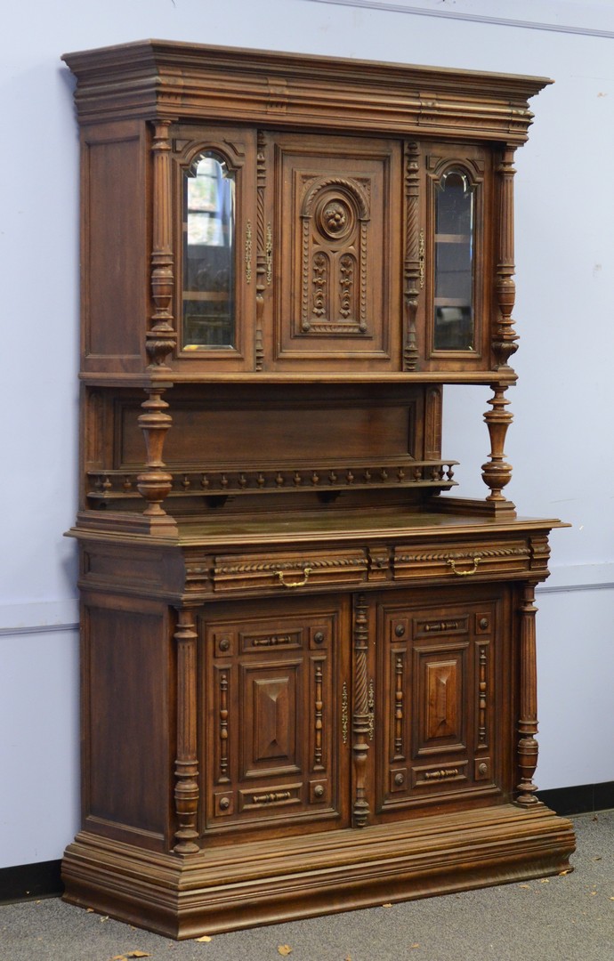 Appraisal: Carved walnut Continental two-piece breakfront top with beveled glass doors