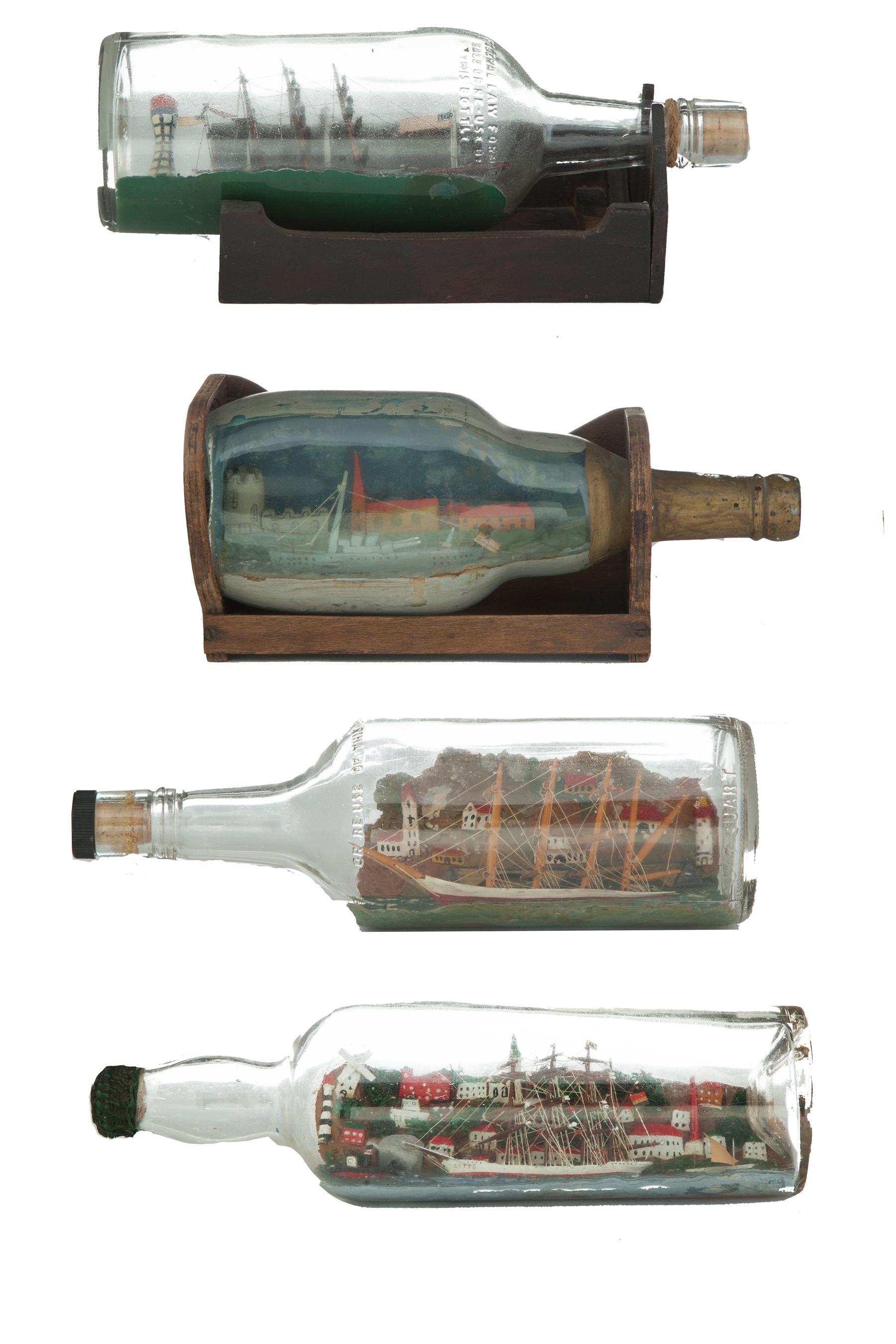 Appraisal: FIVE FOLKSY SHIPS IN BOTTLES American th century Four nicely