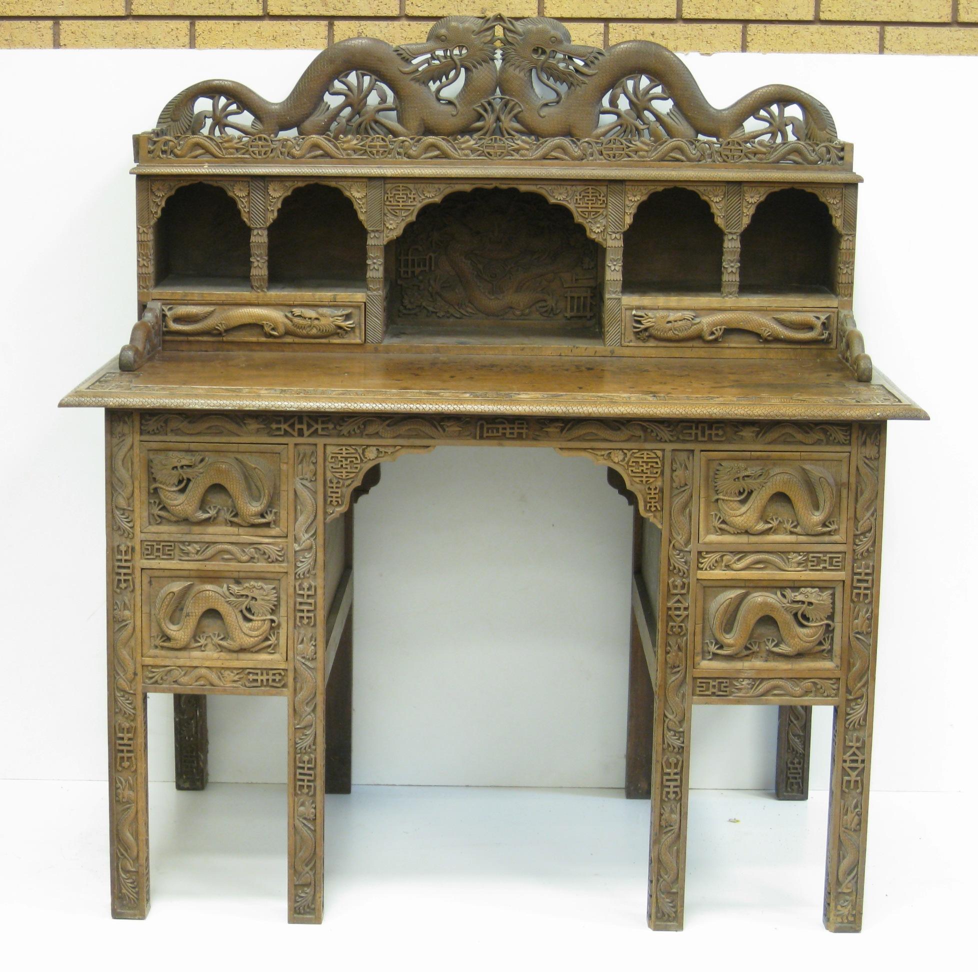 Appraisal: A Kashmir carved hardwood Desk with hinged surmount carved dragon