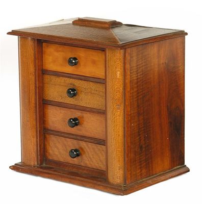 Appraisal: A th century specimen wood small chest of four drawers