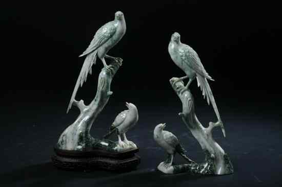 Appraisal: PAIR CHINESE CELADON AND GREEN JADE FIGURES OF BIRDS -