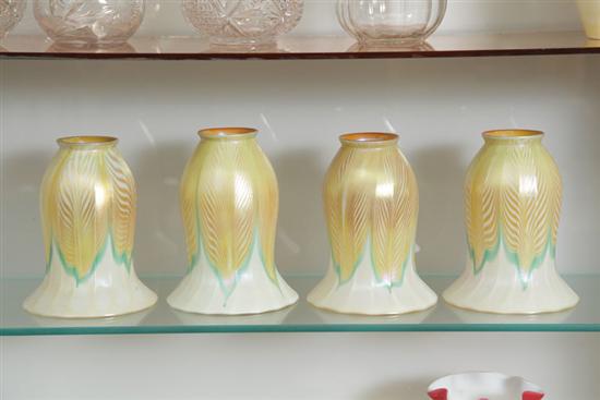 Appraisal: FOUR LUSTRE ART GLASS SHADES Gold iridescent pulled feather decoration