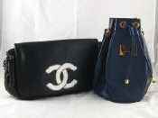 Appraisal: A Chanel handbag in black leather with white logo in