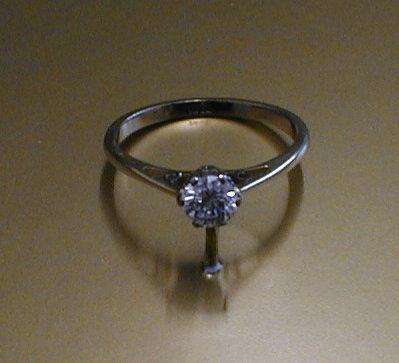 Appraisal: A solitaire diamond ring a brilliant cut round stone of