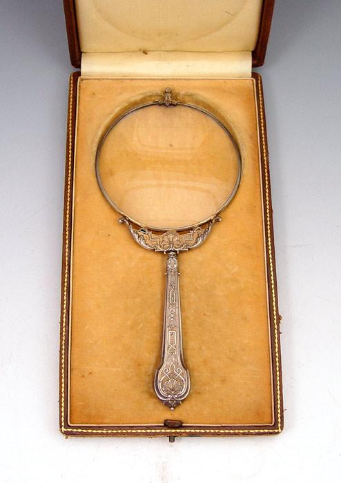 Appraisal: FRENCH STERLING MAGNIFYING GLASS IN PRESENTATION CASE Embossed handle and