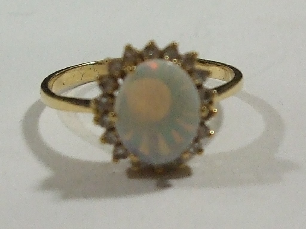 Appraisal: Eighteen carat gold opal and diamond cluster ring