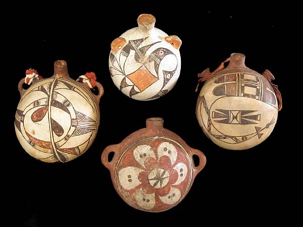 Appraisal: Four Pueblo polychrome canteens Including two Hopi a Zia and