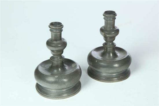 Appraisal: PAIR OF PEWTER CANDLESTICKS European th century Short sticks with