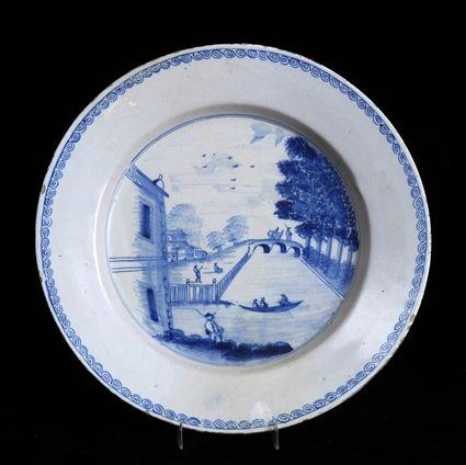 Appraisal: DELFT BLUE AND WHITE CHARGER Centered by canal scene with