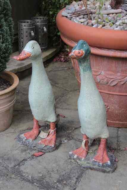 Appraisal: TWO GLAZED POTTERY SCULPTURES OF DUCKS high together with a