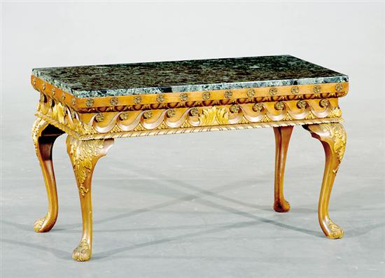 Appraisal: Continental carved walnut and marbletop coffeetable rectangular green mottled marble