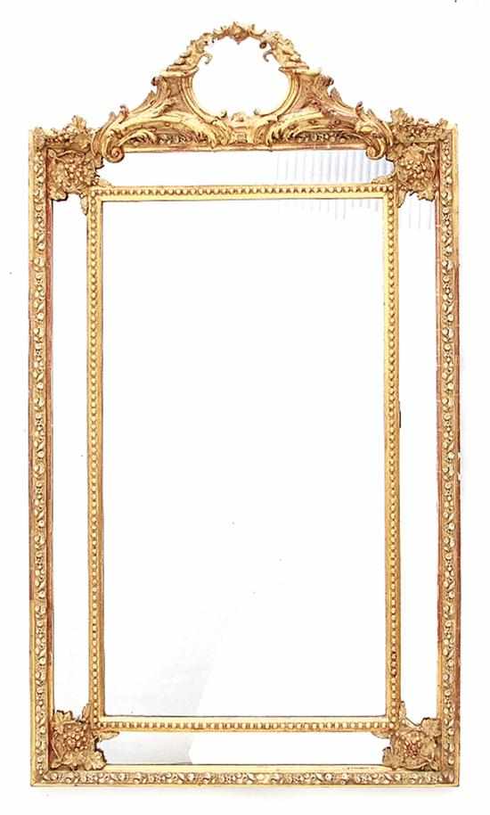 Appraisal: English carved giltwood overmantle mirror mid th century putti medallion