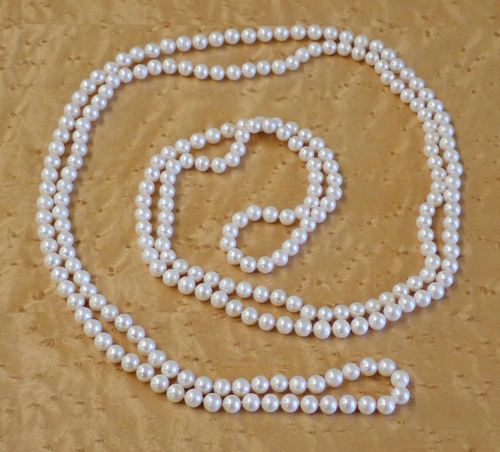 Appraisal: ROPE LENGTH WHITE PEARL NECKLACE hand-knotted strand of well matched