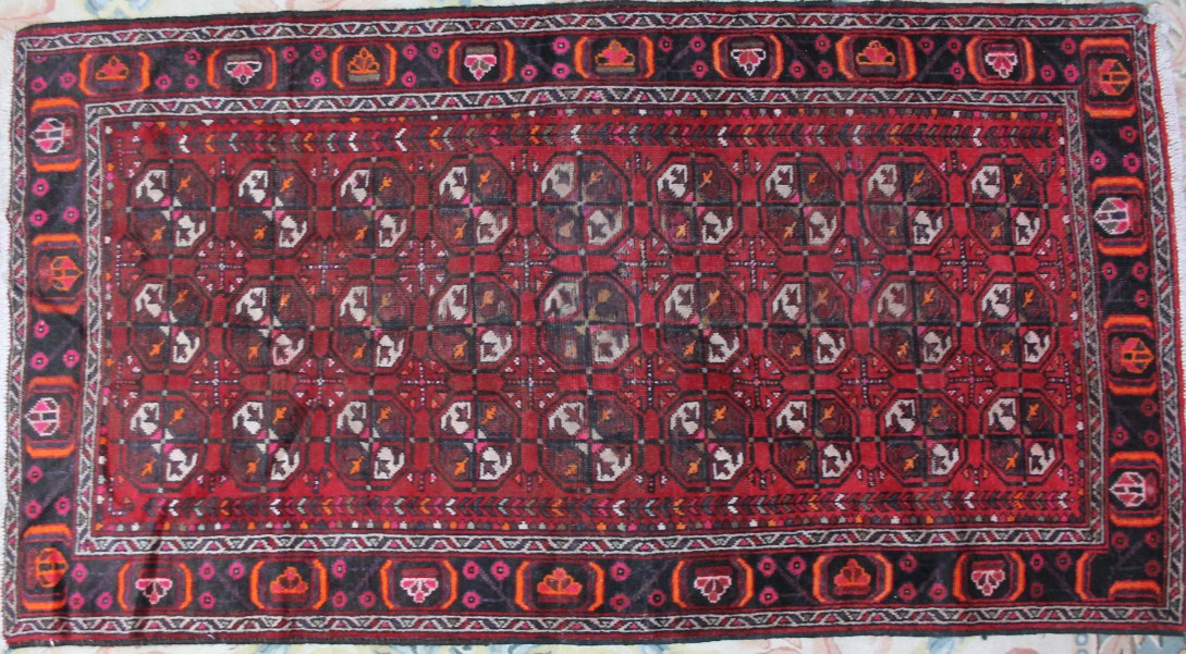 Appraisal: A Torkaman rug repeated in red blue and green cm