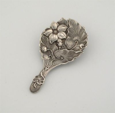 Appraisal: A Victorian 'stamped' spoon stylised leaves and flowers by Harrison