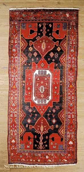 Appraisal: A Persian Rug red and black ground all-over stylized floral