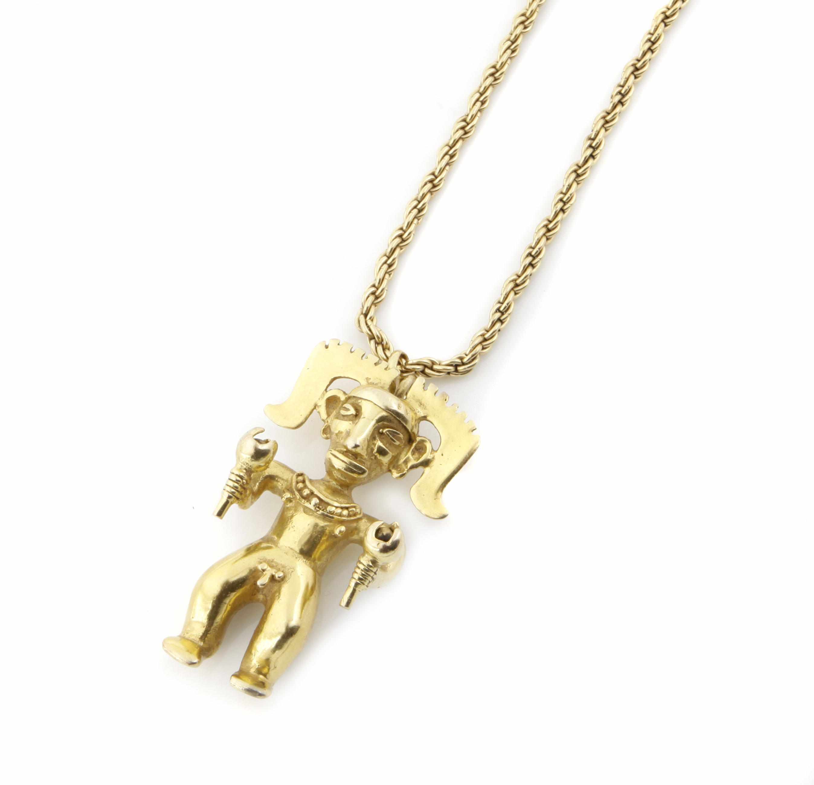 Appraisal: A k gold Meso American figure pendant with a gold-filled