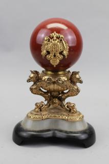 Appraisal: Carved Stone Ball on Figural Gilt Bronze Stand Carved Stone