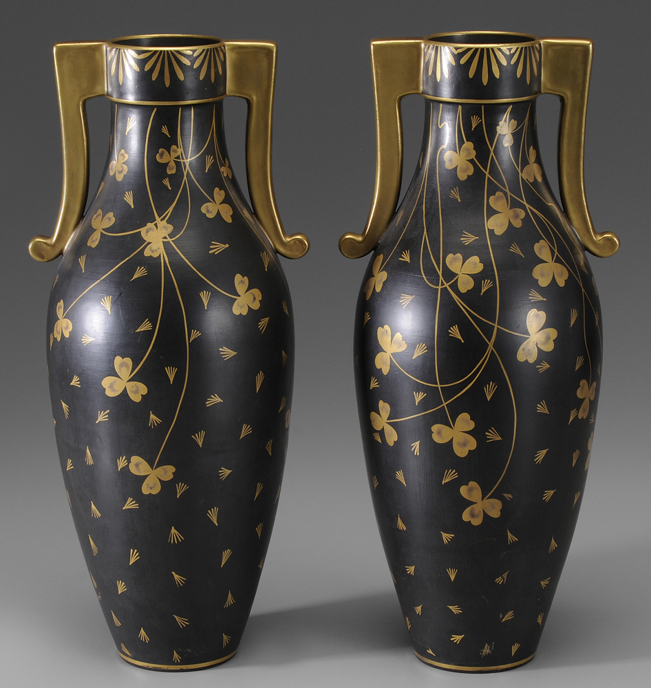 Appraisal: Pair French Porcelain Vases th century shamrocks on black ground