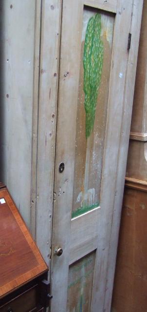 Appraisal: A th century pine tall narrow hall cupboards with small