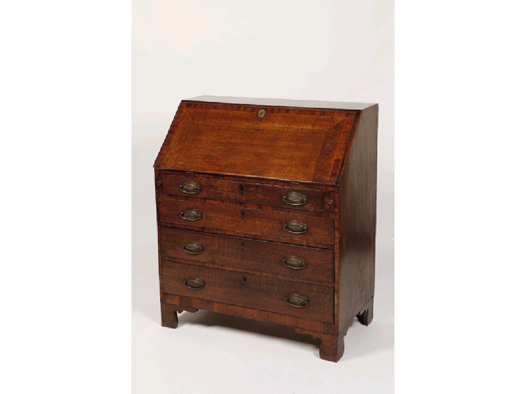 Appraisal: A GEORGE III OAK AND MAHOGANY CROSSBANDED BUREAU the sloping