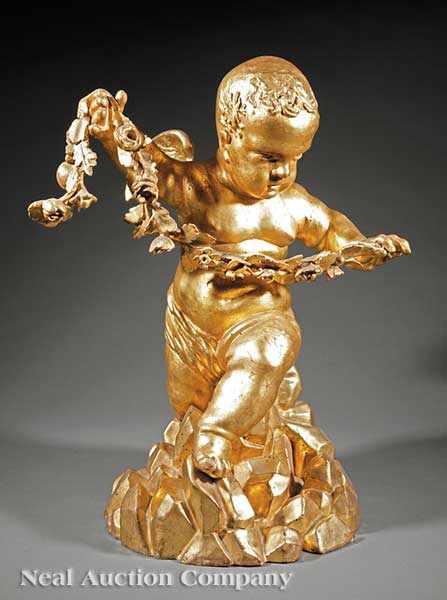 Appraisal: An Antique Continental Carved Giltwood Figure of a Putto Holding