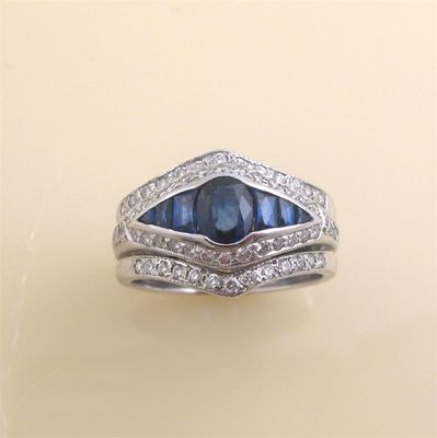 Appraisal: A sapphire and diamond ring Set with an oval shaped