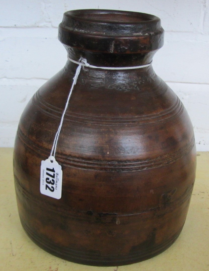 Appraisal: A fruitwood turned vessel late th century of ribbed shouldered